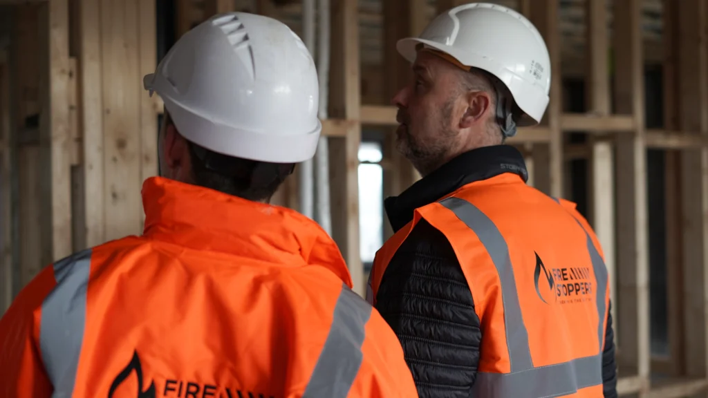 two passsive fire protection engineers conducting a site survery at a commercail premises iin north dublin